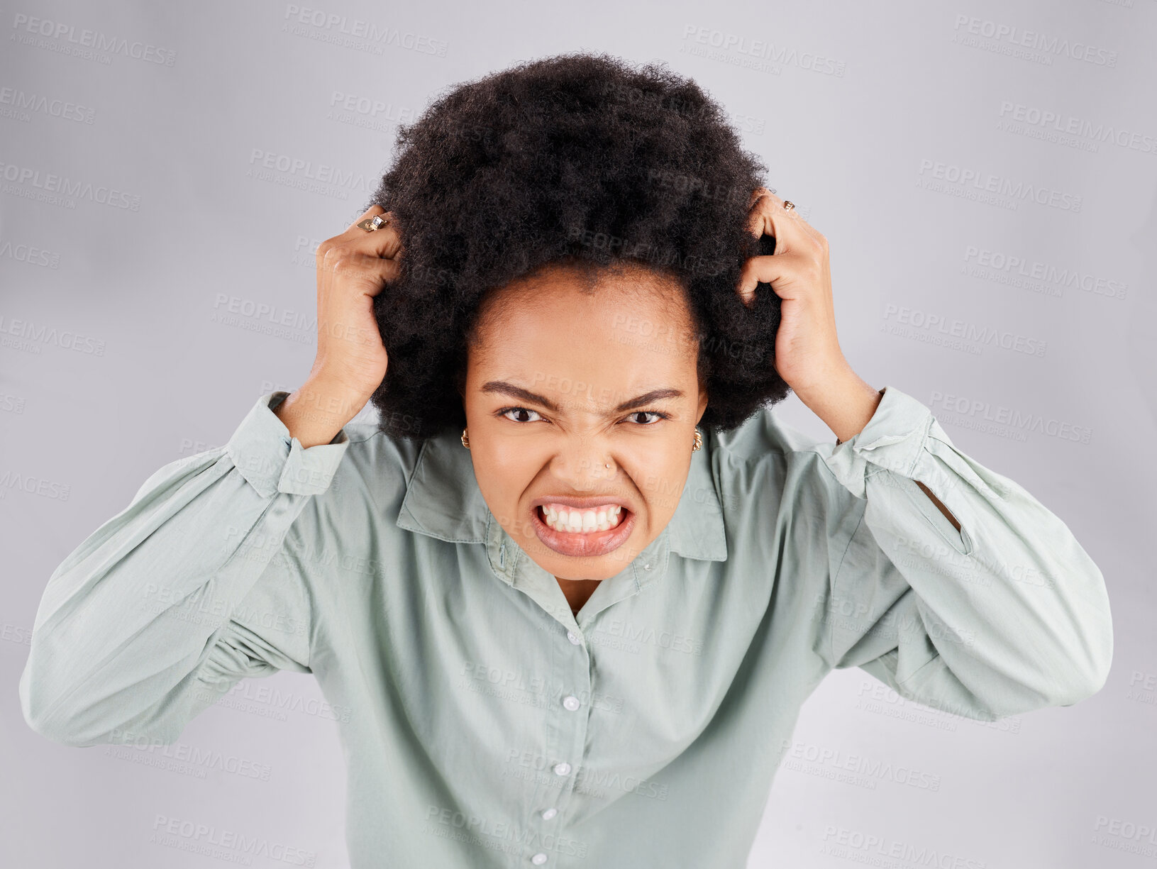 Buy stock photo Angry, frustrated and woman portrait with hair pull with stress and burnout. Mental health, face and anger problem from female with anxiety and extreme emotion in isolated studio with grey background