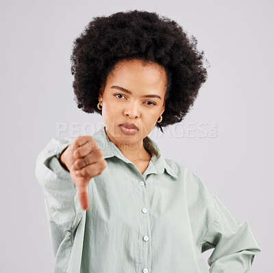 Buy stock photo Portrait, thumbs down and black woman serious in studio isolated on a white background. Hand gesture, person or female with dislike emoji, negative opinion or no, rejection or failure, vote or wrong.