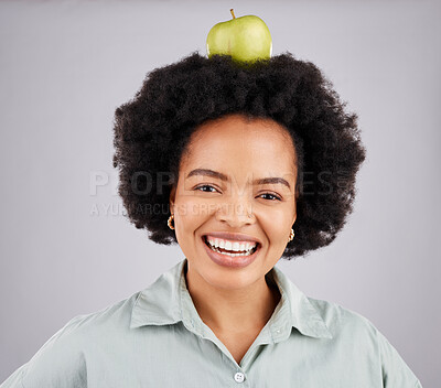 Buy stock photo Apple on head, balance and portrait of black woman in studio for nutrition, wellness and healthy snack. Food, diet and girl smile with fruit for detox, vitamins and weight loss on white background