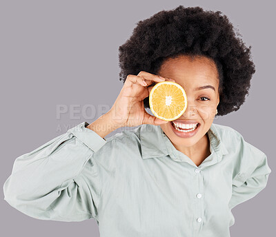 Buy stock photo Portrait, orange and black woman smile with fruits in studio isolated on a gray background. Food, top view and happiness of person with vitamin c, nutrition or healthy diet, citrus or vegan detox.