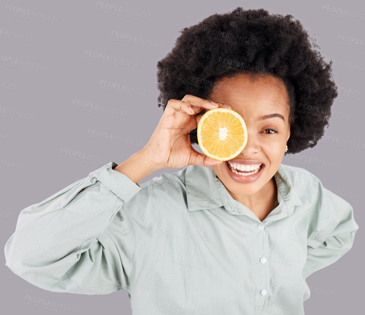 Buy stock photo Portrait, orange and black woman smile with fruits in studio isolated on a gray background. Food, top view and happiness of person with vitamin c, nutrition or healthy diet, citrus or vegan detox.