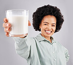 Portrait, happy woman and glass of milk in studio, white background and backdrop for healthy diet. Female model, food and calcium of smoothie, vanilla milkshake and nutrition of weight loss drink 