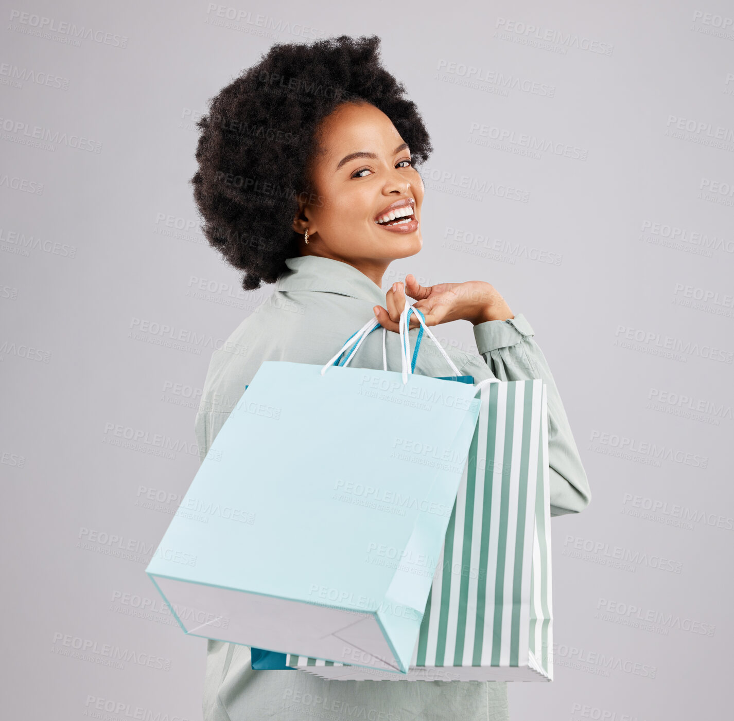 Buy stock photo Portrait, shopping bags and black woman laughing in studio isolated on a white background. Sales deals, fashion and happiness of person or customer with products after buying at mall, store or shop.