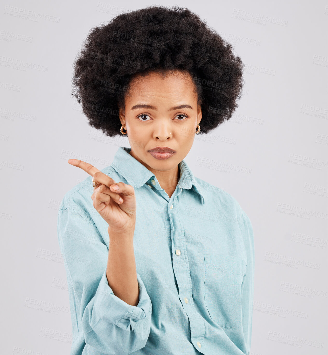 Buy stock photo Finger, serious and portrait of black woman in studio with hand gesture for disagreement, upset and anger. Mockup space, white background and isolated girl point for angry, no and disappointment sign