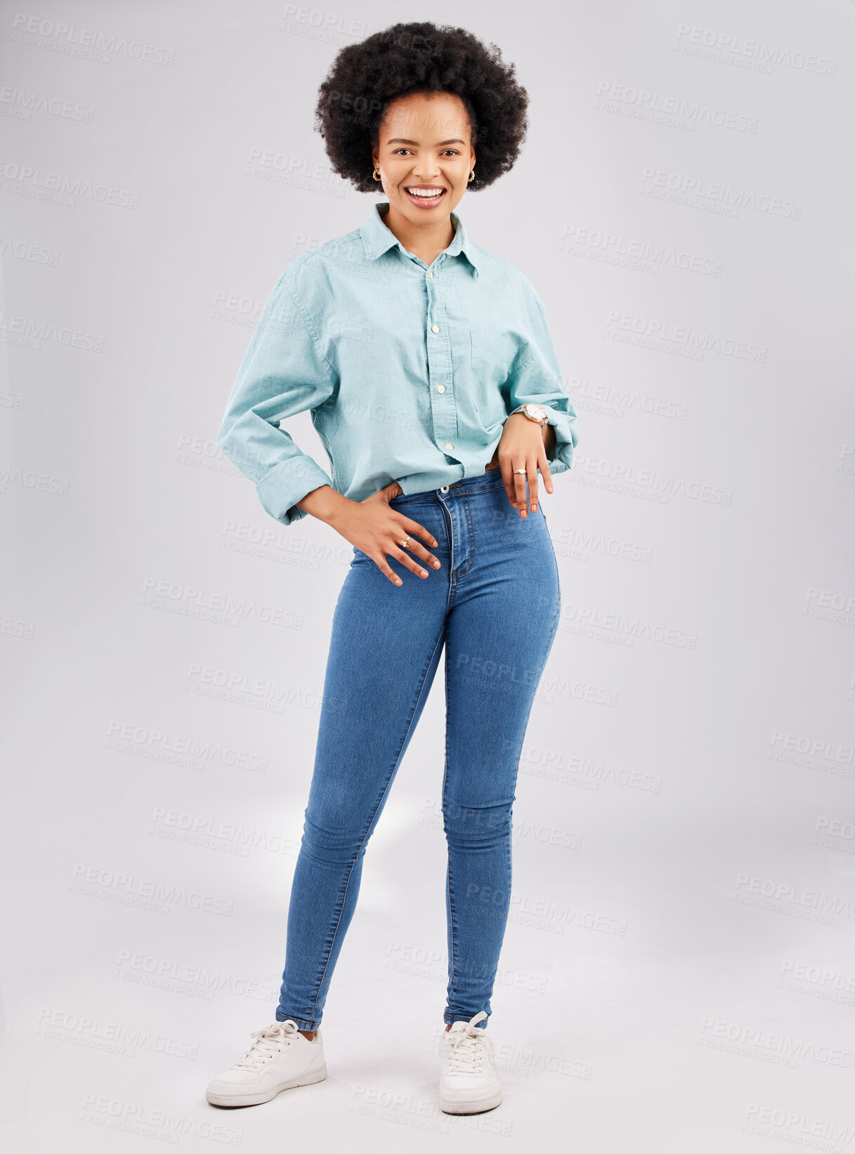 Buy stock photo Fashion, casual and young black woman in a studio with a stylish and trendy outfit with a jeans and shirt. Happy, smile and portrait of an African female model with style isolated by gray background.