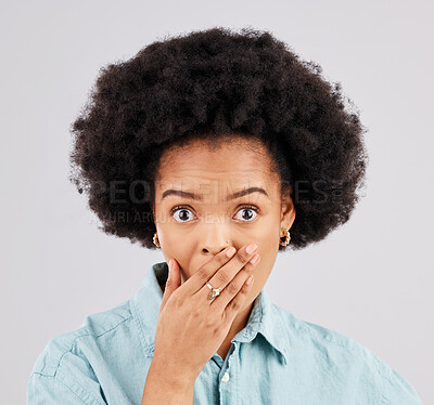 Buy stock photo Portrait, hand and mouth with a surprised woman in studio on a gray background feeling shocked by gossip. Face, wow or afro and a young female hearing news with an omg or wtf expression of disbelief