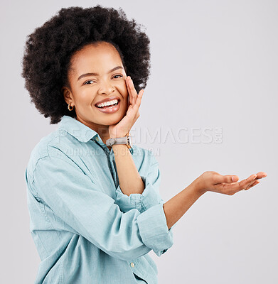 Buy stock photo Product placement, hand and portrait of black woman in studio for branding, advertising and choice gesture. Promotion, mockup space and happy girl show hands for marketing, presentation and logo