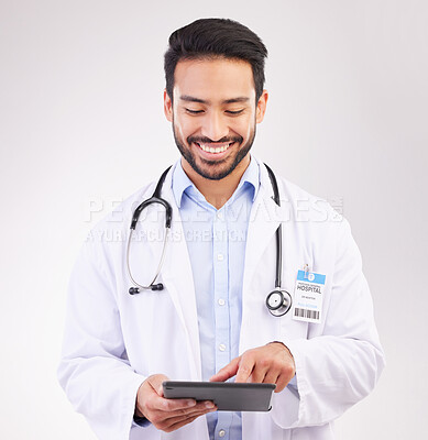 Happy asian man, doctor and tablet in healthcare research, Telehealth or communication against a white studio background. Male medical professional smiling on touchscreen for good health results