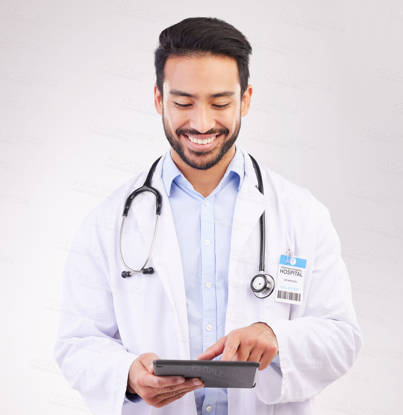 Buy stock photo Happy asian man, doctor and tablet in healthcare research, Telehealth or communication against a white studio background. Male medical professional smiling on touchscreen for good health results