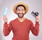 Ticket, camera and portrait of excited man with paperwork for holiday, adventure and fun hat on white background. Smile, travel and happy person with boarding pass for vacation, journey and happiness