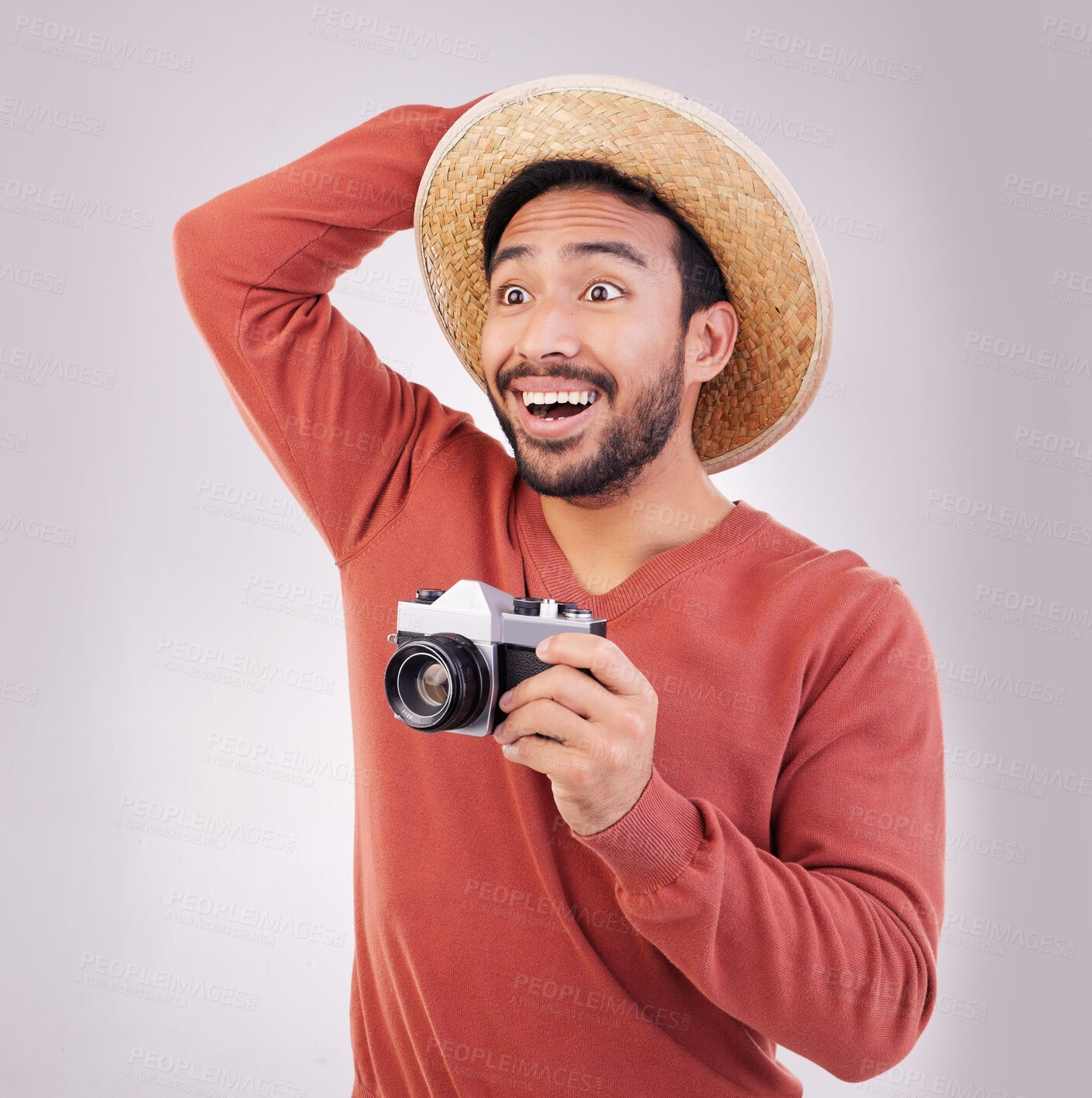 Buy stock photo Wow, camera and travel, shocked man in studio with hat on holiday, adventure and fun on white background. Smile, surprise and happy person on vacation, happiness and shock for photographer on journey