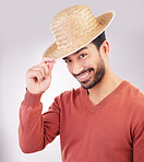 Happy, handsome and portrait of an Asian man with a hat isolated on a white background in studio. Smile, trendy and a guy wearing headwear made of straw with confidence and happiness on backdrop