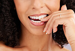 Woman, mouth and teeth closeup, flirt and bite finger with hand and manicure with beauty, dental and whitening. Makeup, natural cosmetics and flirtatious female, skincare and glow with orthodontics