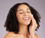 Cotton, beauty and face of happy woman in studio with salon cosmetics on background. Facial model, smile and makeup pad for dermatology, aesthetic skincare or product of transformation, shine or glow