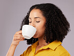 Calm woman, coffee and drinking in studio, backdrop and background for warm beverage, latte and taste of espresso. Female model enjoying cup of tea, cappuccino and good mood for break, calm and peace