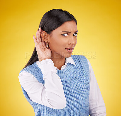 Buy stock photo Portrait, confused and gossip with a woman on a yellow background in studio listening to a secret. Hand gesture, doubt and shock with an attractive young female cupping her ear to hear a rumor