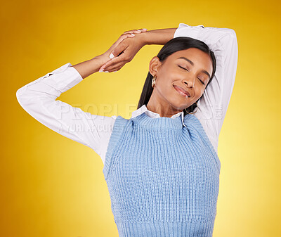 Buy stock photo Relax, stretching and a woman on a yellow background in studio for peace, quiet or free time. Freedom, sleepy or lifestyle and an attractive young female posing with her eyes closed for a stretch