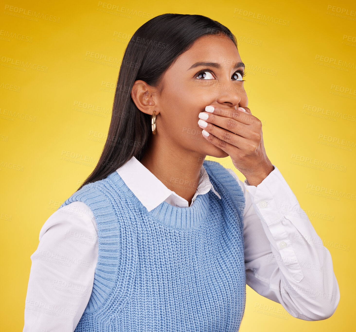 Buy stock photo Shock, surprise and young woman in a studio with her hand on her mouth for a wtf expression. Shocked, ecstatic and Indian female model with wow or omg face for good news isolated by yellow background