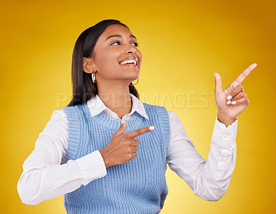 Buy stock photo Woman, portrait and gun fingers in a studio pointing with emoji hand gesture with a smile. Happiness, business female and happy youth with proud and cool hands sign in isolated yellow background