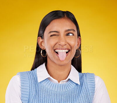 Buy stock photo Funny, emoji and woman with tongue out, happy and cheerful against a studio background. Female, stress relief and girl with facial expression, humor and goofy action for joy, crazy and happiness