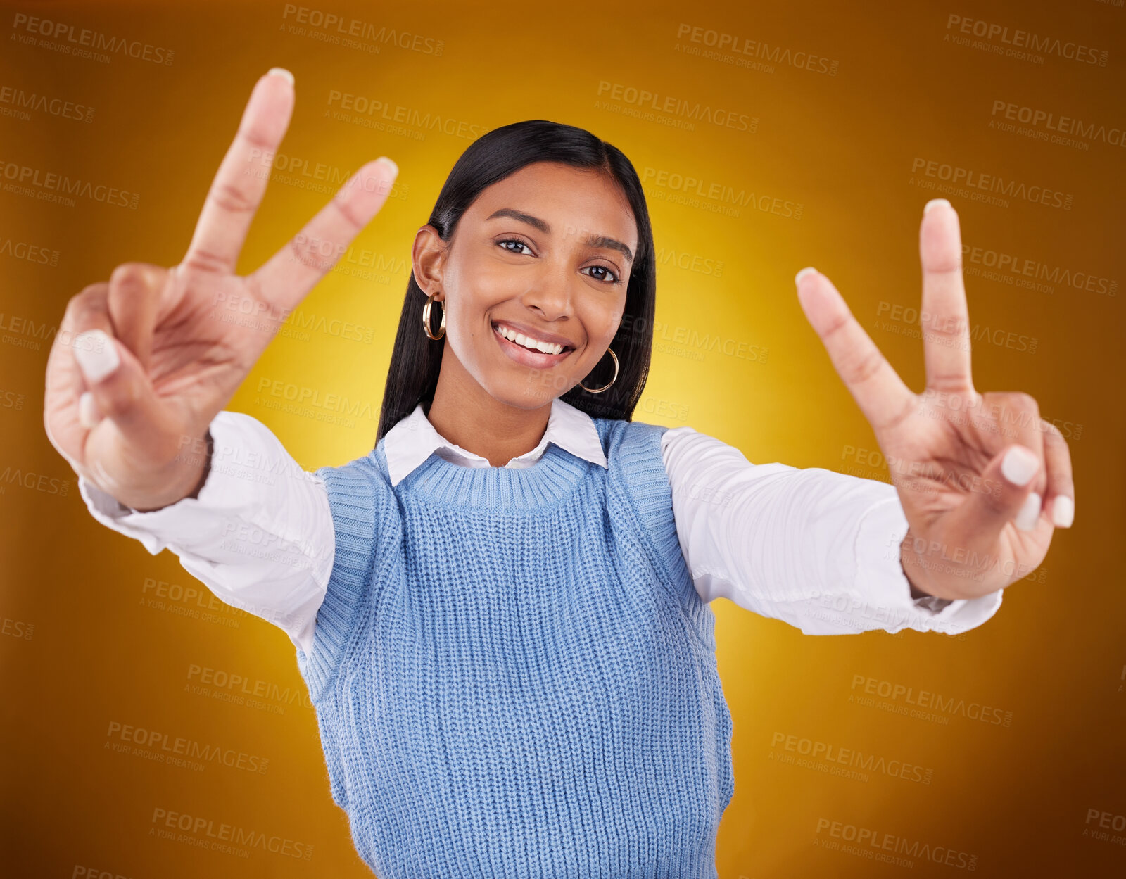 Buy stock photo Hands, peace sign and portrait of Indian woman in studio for happiness, confident and smile on brown background. Emoji mockup, fashion and girl with hand gesture with beauty, cosmetics and style