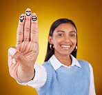 Smiley, fingers and portrait of indian woman in studio for art, expression and fun on gradient yellow background. Hands, art and drawing by girl smile, excited and content with emoji, gesture or face