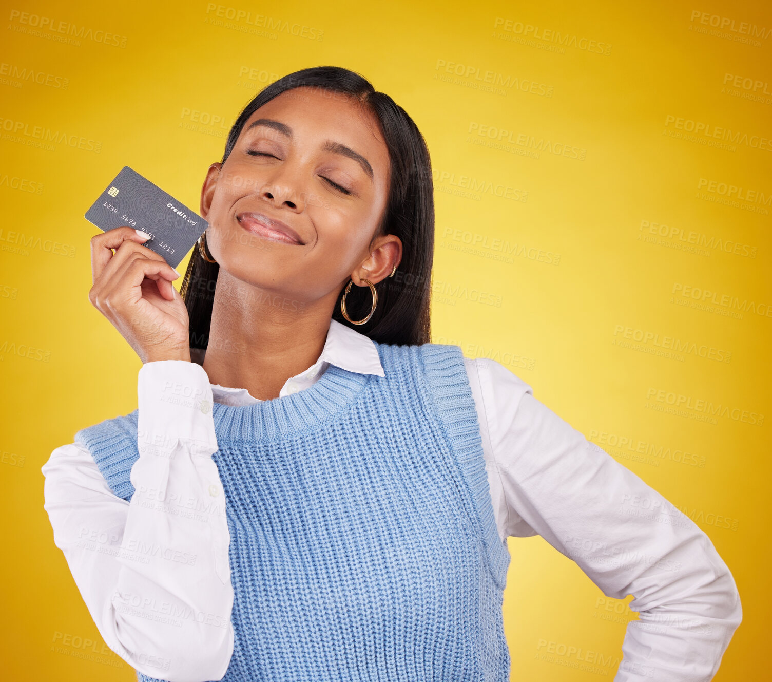 Buy stock photo Credit card, smile and Indian woman on yellow background for bank, investment and payment in studio. Banking mockup, finance and happy girl with plastic for budget, commerce and promotion purchase