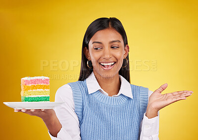 Buy stock photo Birthday, smile and woman with cake in studio for happy celebration or party on yellow background. Happiness, excited gen z model with rainbow dessert on plate to celebrate milestone or achievement.