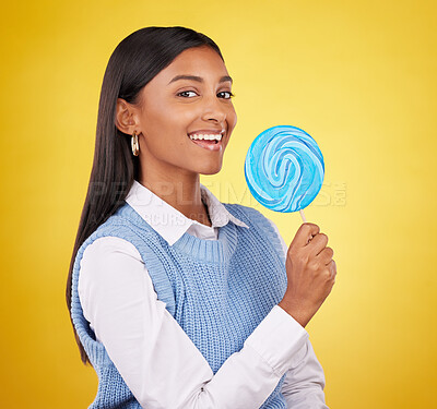 Buy stock photo Smile, lollipop and candy with portrait of woman in studio for sweets, snack and food. Treats, dessert and sugar confectionery with female isolated on yellow background for diet, eating and happy 