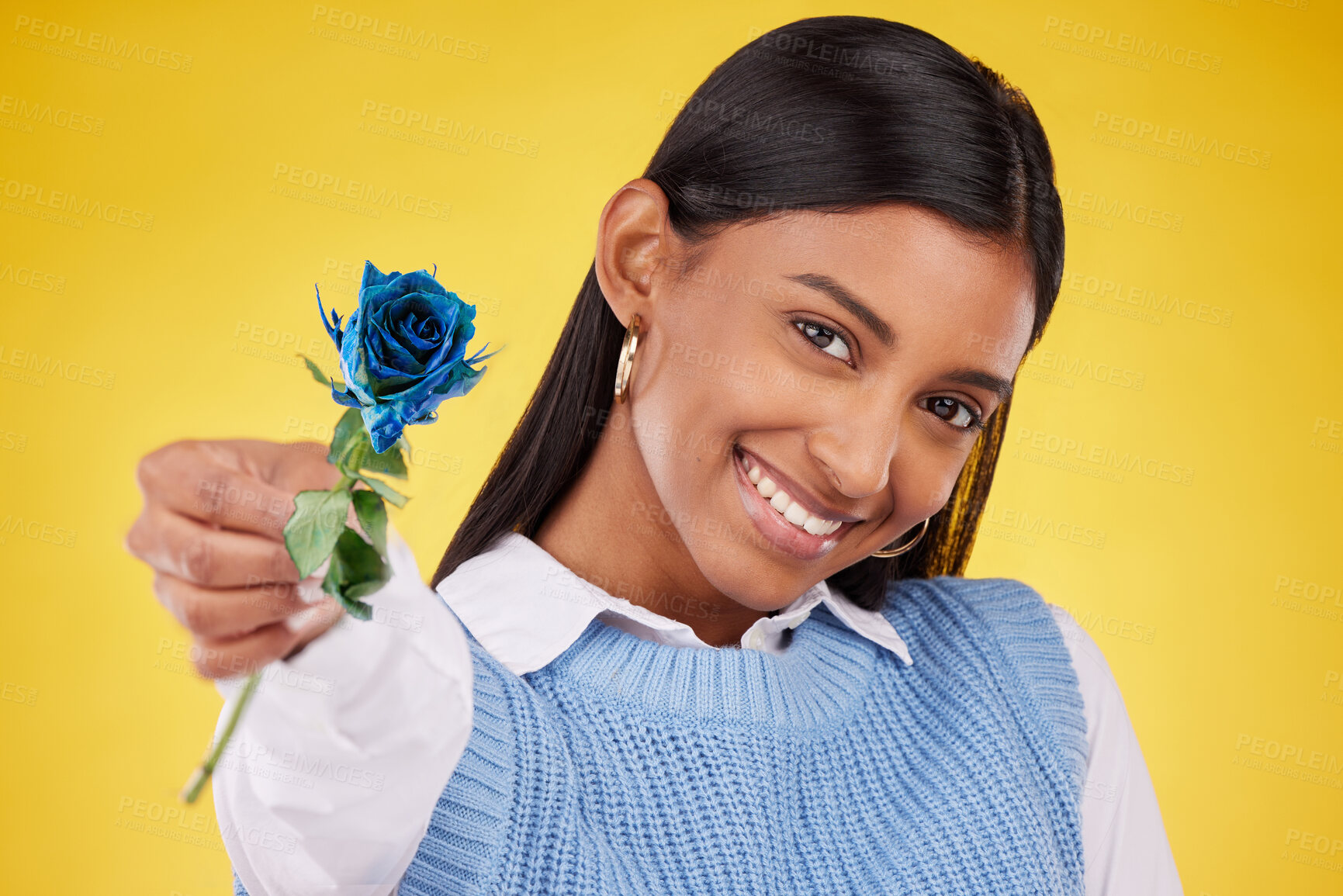 Buy stock photo Portrait, love and rose with a woman on a yellow background in studio for valentines day. Face, blue flower and smile with a happy young female holding a plant for romance or anniversary celebration