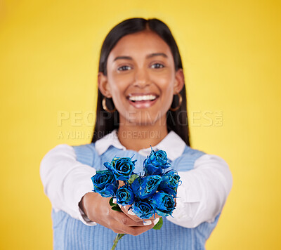 Buy stock photo Portrait, love and roses with a woman on a yellow background in studio for valentines day. Face, blue flowers or smile with a happy young female holding a plant for romance or anniversary celebration