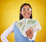 Money bills, studio portrait and woman smile for lottery win, competition giveaway or cash award. Finance bonus, payment or prize winner of poker, bingo or casino gambling on yellow background