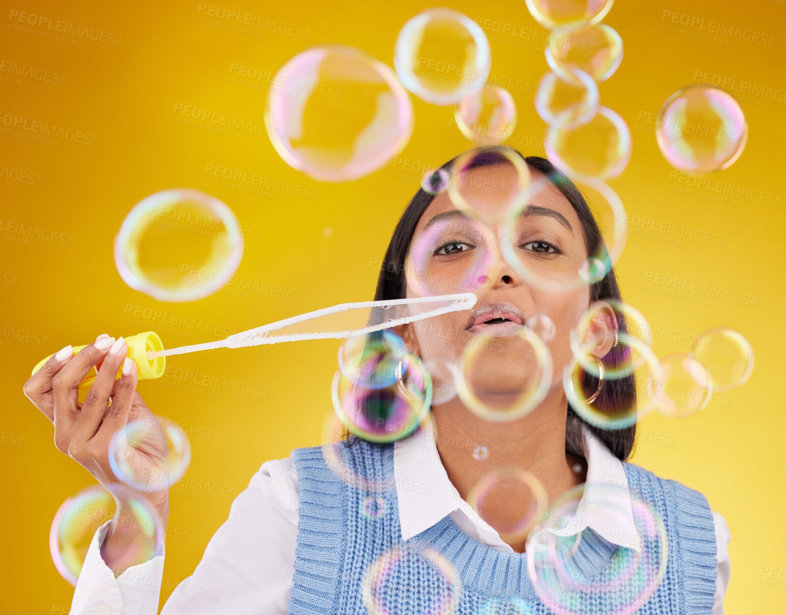 Buy stock photo Portrait, fun and woman blowing bubbles, positive attitude and cheerful against a studio background. Face, female and lady with soap bubble, excitement and joyful with wellness, break and playful