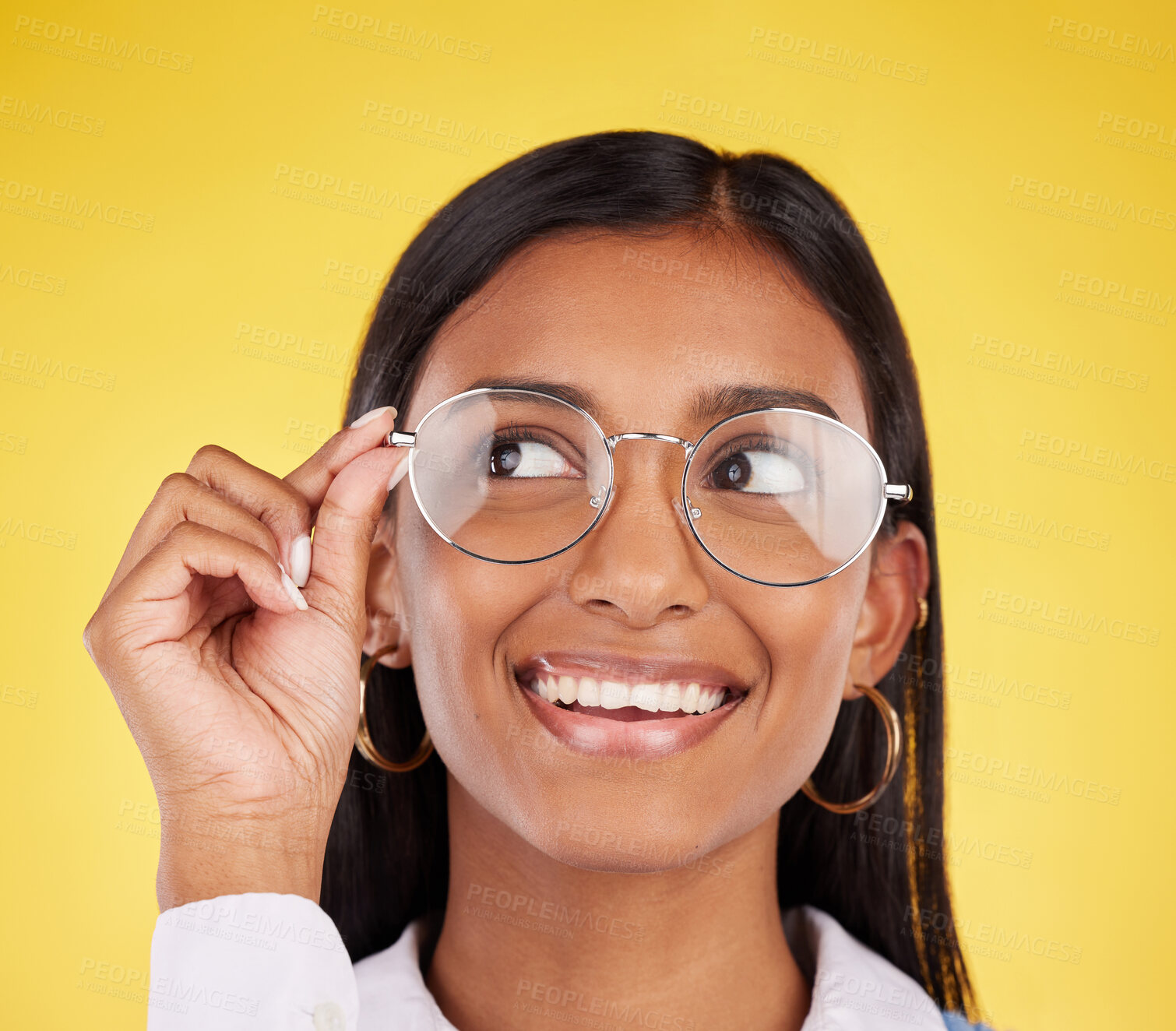 Buy stock photo Happy, smile and woman with glasses in a studio for optical health, wellness and awareness. Happiness, optometry and Indian female model with spectacles for eye care isolated by a yellow background.