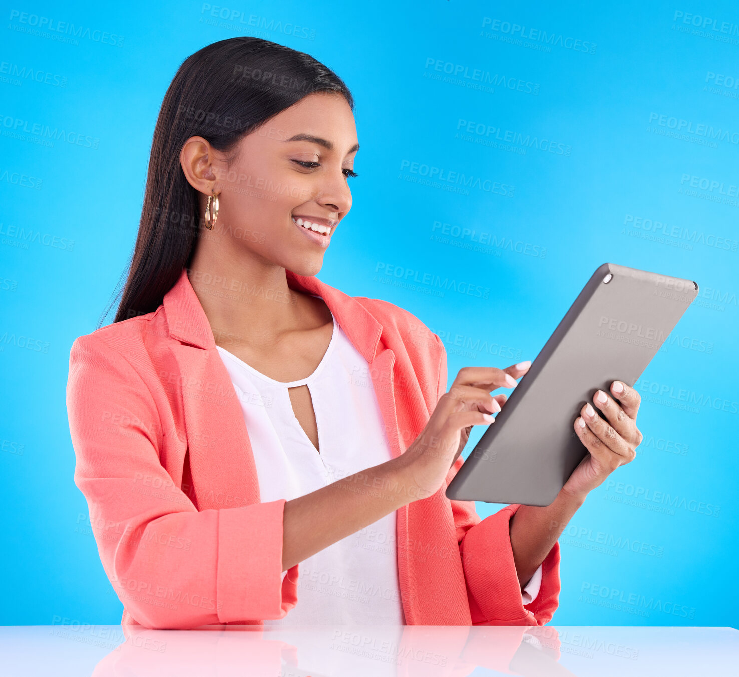 Buy stock photo Happy woman, tablet and smile for research, browsing or social media and communication against a blue studio background. Female employee working on touchscreen for business data or search on mockup