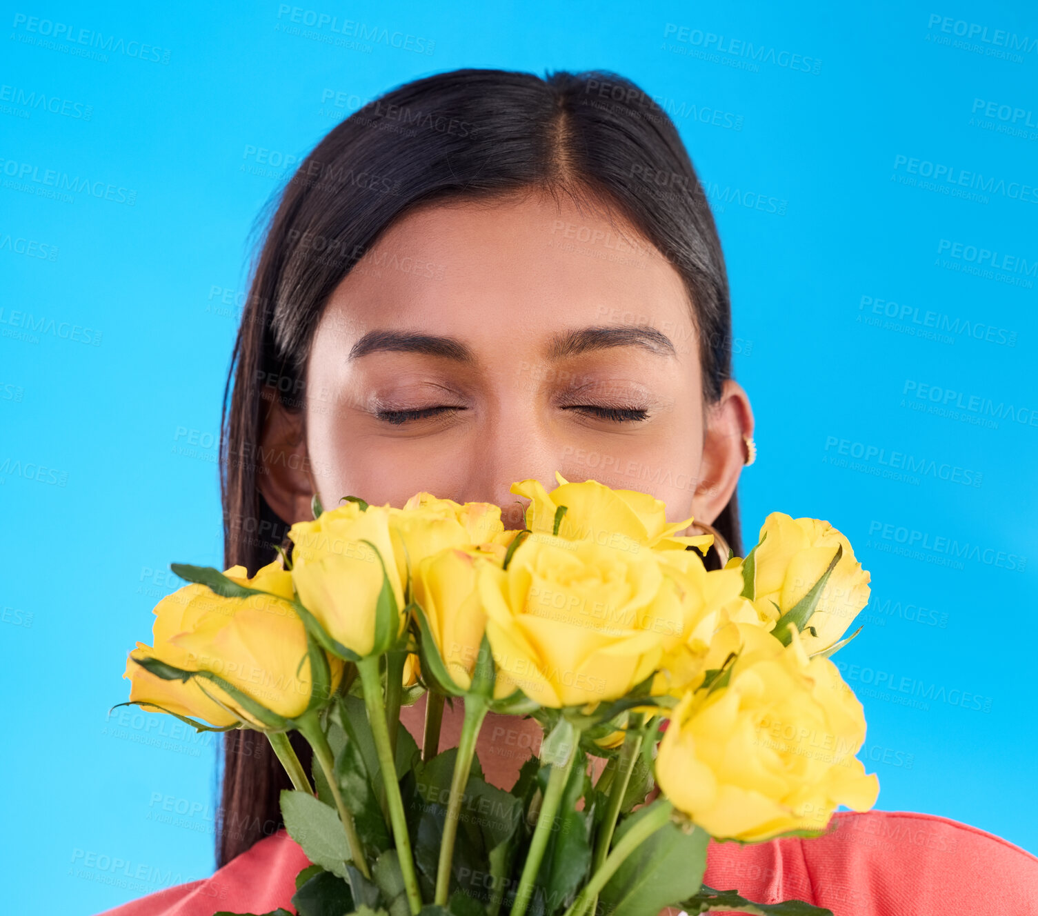 Buy stock photo Smell, flower bouquet and roses with woman in studio for gift, satisfaction and spring. Relax, happy and floral present with female isolated on blue background for aroma, natural and products