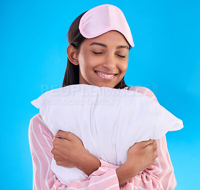 Buy stock photo Bedtime, happy and a woman hugging a pillow isolated on a blue background in a studio. Smile, comfy and a girl ready for sleep, nap or slumber in pyjamas for comfort and coziness on a backdrop