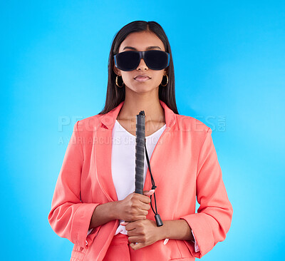Buy stock photo Blind, face and woman with disability in a studio with guide cane for eyes impairment help. Glasses, serious or young female person in post eye surgery on isolated blue background with vision problem