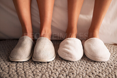 Buy stock photo Feet, slippers and together on floor in bedroom, spa or hotel to relax in morning with luxury hospitality. Women, house shoes and carpet in room, apartment and footwear for comfort on home flooring