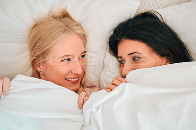 Buy stock photo Love, above and lesbian couple in bed, waking up and bonding in their home together. Lgbt, gay and happy women sharing romance, relationship and sweet moment in a bedroom, in love and content