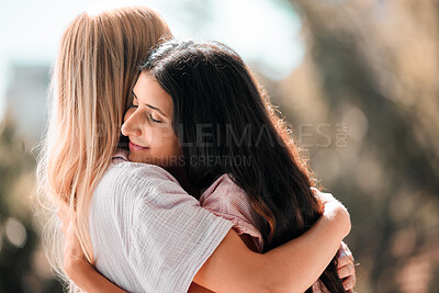 Buy stock photo Woman friends, hug and reunion outdoor in park, garden or backyard with love, care and bonding in summer. Women, embrace and happiness for meeting, welcome and support in sunshine for solidarity