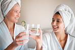 Spa, happy and friends cheers with a drink, luxury bonding and wellness pampering together. Smile, toasting and women drinking water for a detox, nutrition and diet during a relaxation day at home