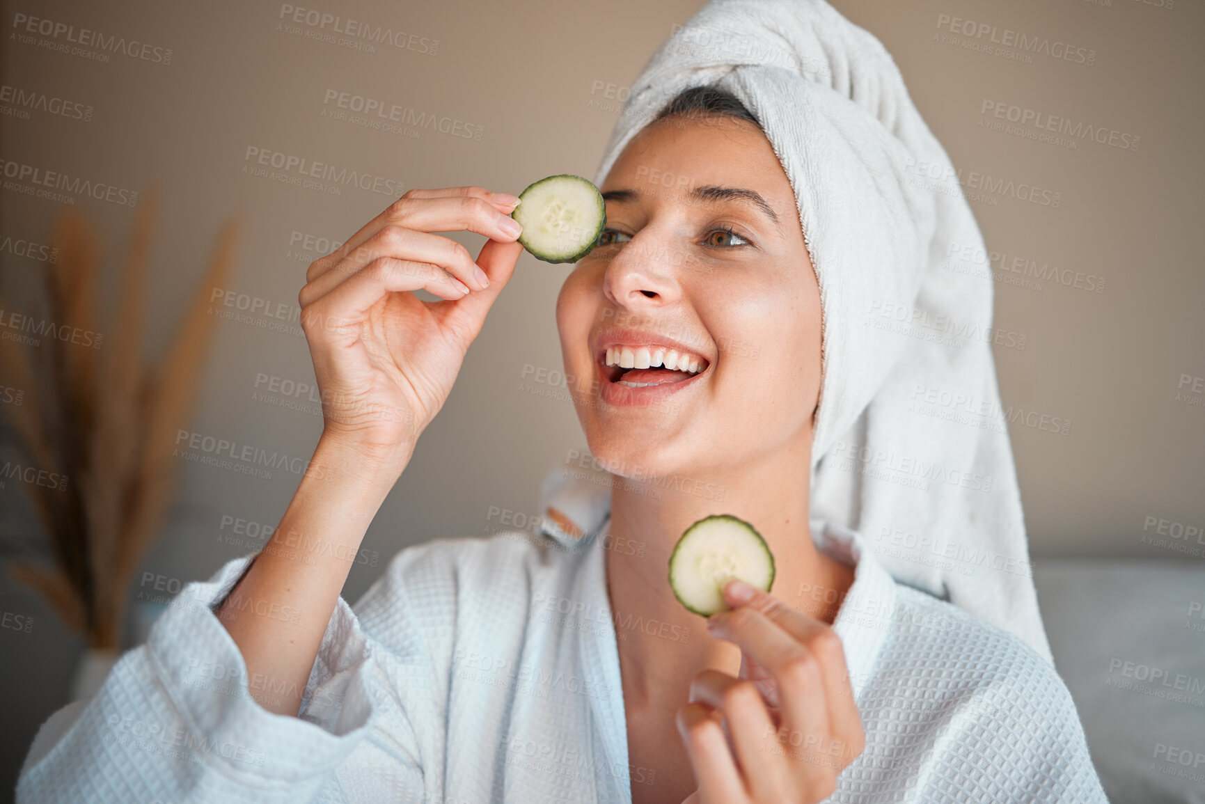 Buy stock photo Happy woman, cucumber and natural skincare for beauty, cosmetics or facial treatment at spa. Female smiling and applying vegetable to eyes for organic healthcare, hydration or dermatology at salon