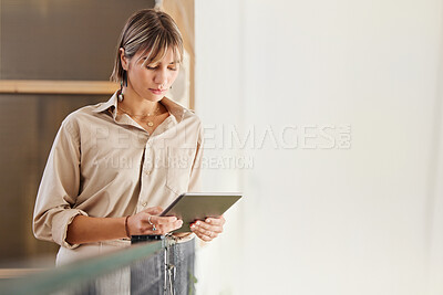 Buy stock photo Modern office, woman with tablet standing and reading email, website or checking social media news. Digital information, business research and online content, businesswoman on web search in workplace