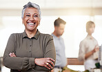 Happy, pride and portrait of a woman with arms crossed in a meeting, seminar or workshop. Smile, leadership and elderly ceo smiling for success of a company at a conference or coworking space