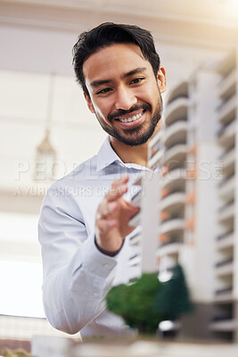 Buy stock photo Architect, happy man and check architecture model, construction and building with smile on face and building project. Businessman in office, design and engineer, property development and construction