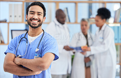 Hospital, doctor and portrait of man in healthcare clinic for insurance, wellness and medical service. Medicine, stethoscope and health worker smile with crossed arms for care, consulting and help