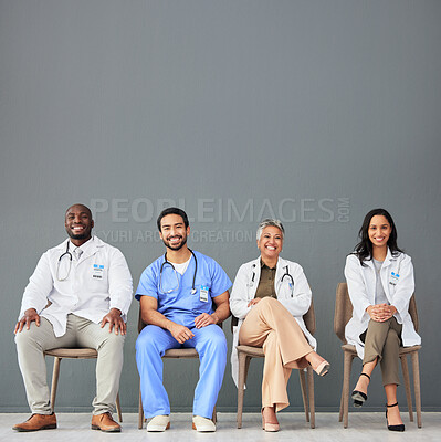 Buy stock photo Healthcare, doctors and portrait of team on chair on wall background for insurance, wellness and medical mockup. Hospital, teamwork and men and women sitting in line for consulting, help and service