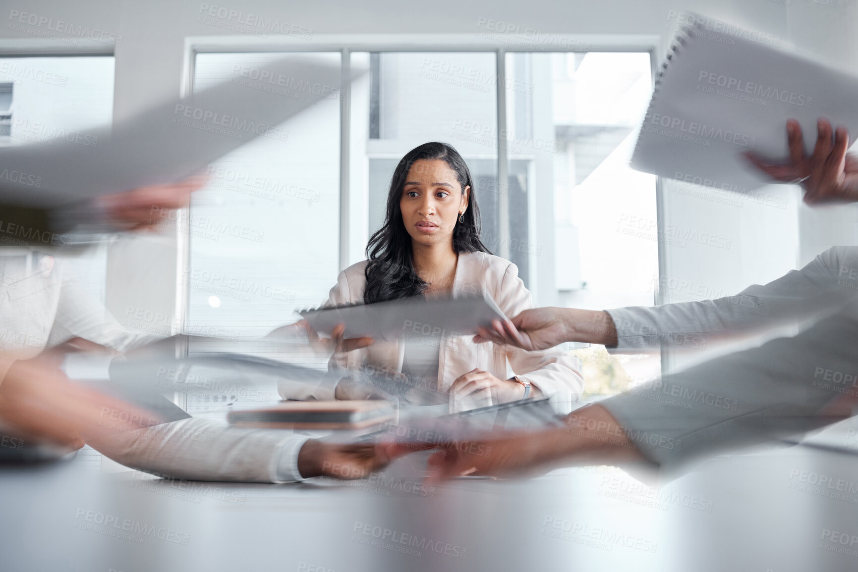 Buy stock photo Business woman, anxiety and stress in a meeting or busy office with documents or paperwork. Professional female manager at table with team hands for stress, depression or burnout for deadline crisis