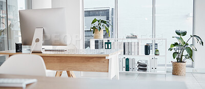 Buy stock photo Empty office, interior and computer on desk in workplace, company or workspace. Room, desktop and table with corporate furniture, plants and window with modern design for business with nobody.